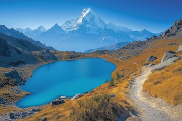 Fototapeta premium Stunning mountain landscape featuring a crystal-clear lake surrounded by rocky terrain at sunrise