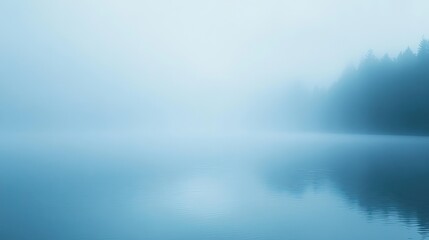 Fototapeta premium Serene Misty Lake Scene with Ripples and Forest Silhouette
