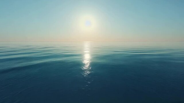 Sun reflection over calm water and cloudless sky landscape