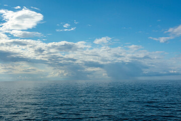 Fototapeta premium Seascape, white cumulus clouds over the Black Sea, Abkhazia, summer sunny day