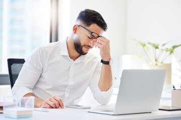 Frustrated, businessman or headache with laptop for strain, pressure or stress at office desk. Man, employee or accountant with migraine on computer for debt, vertigo or financial crisis at workplace