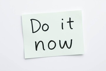 Text do it now on blue note on white background