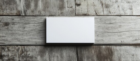 Blank business card mockup on rustic wooden background with natural texture and Copy Space for design elements or text.