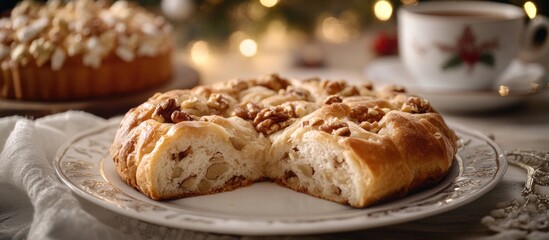 Festive baked goods on a table with nut-studded pastry and coffee cup in background Copy Space