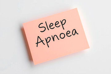 Text sleep apnoea on pink note on white background
