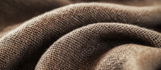 Textured close-up of soft brown fabric with natural fibers and folds showcasing details and patterns Copy Space