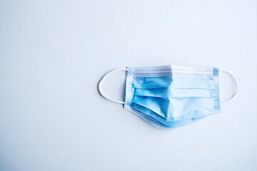 a blue medical mask on a white background
