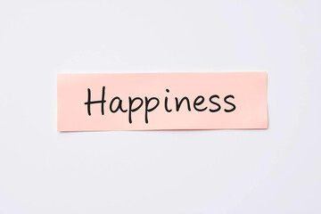 Text Happiness on pink note on white background