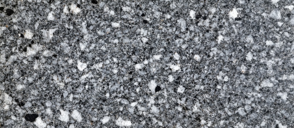 Poster granite texture background with a speckled pattern in gray and black shades suitable for various des