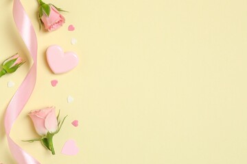 Beautiful composition with pink roses and gift box on color background