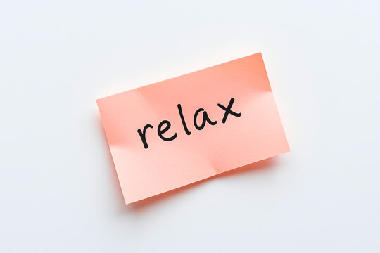 Text relax on pink note on white background