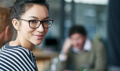 Professional woman, portrait and meeting at startup, creative brainstorming with team or workshop...