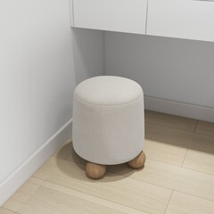 The image features a small, modern, soft stool with light fabric and wooden legs, placed beside a minimalist white desk in a cozy, stylish interior