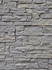 Modern facade of a house decorated with stone