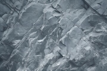 Obraz premium Abstract Monochromatic Close-Up of a Jagged Rock Face Intricate Textures and Layered Stone Patterns in Black and White.