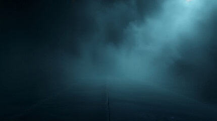 Empty concrete road disappearing into dark fog with light beams at night