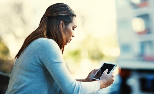 Business woman, reading and tablet on balcony with contact, notification or check schedule at media company. Person, writer and digital touchscreen with research, notes or lead for article in profile