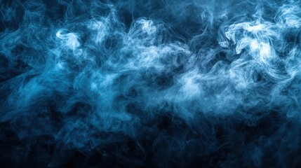 Blue smoke swirls on black background creating abstract artistic patterns and textures