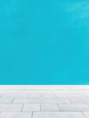 Fototapeta premium Bright turquoise wall meets a clean, white tiled floor.