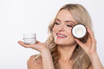 A Beautiful Woman Gracefully Holding Moisturizers for Her Skincare Routine and Treatment