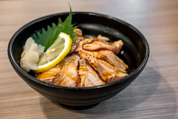 Grilled Salmon with rice, served in a bowl in the restaurant