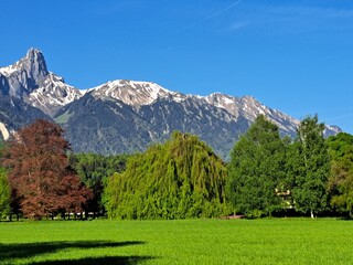 Swiss green mountains, spring. Snowy mountains in spring. Green hills. The Swiss mountains.