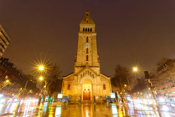 Obraz premium Saint-Pierre-de-Montrouge church at rainy night . It was built in the Ottoman era in the 14th district of Paris, France.