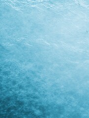 A serene expanse of tranquil blue water, gently rippling under a soft light.