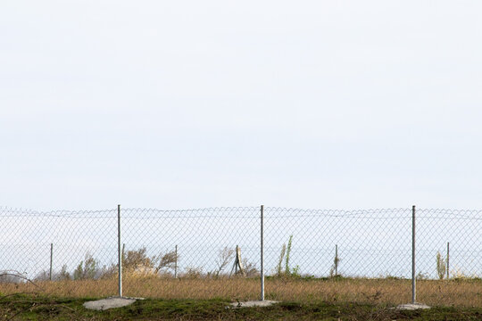 Garden wire and empty sky. Stainless steel fencing wire. Safety equipment. Garden wires are networks woven with steel cables. 
