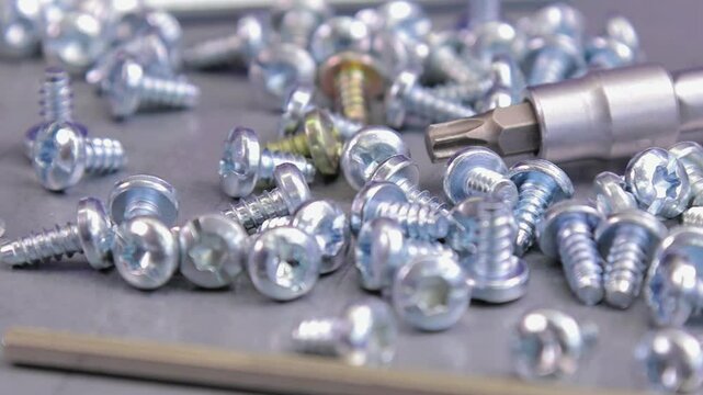 Metal screws for fastening equipment. Soft focus. Close-up. 