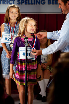 Spelling: Spelling Winner Receives Medal
