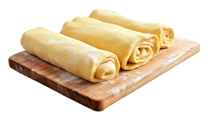 Rolled dough on wooden cutting board with transparent background