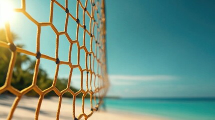 Beach volleyball net under sunny blue sky with ocean view