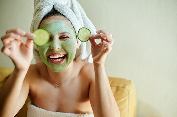 Portrait, cucumber and woman with skincare, mask and organic facial for dermatology treatment....