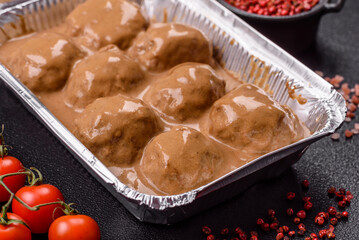 Meatballs with salt and spices in creamy caramel sauce