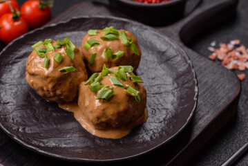 Meatballs with salt and spices in creamy caramel sauce