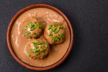 Meatballs with salt and spices in creamy caramel sauce