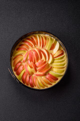 Raw sweet apple pie in a mold prepared for baking