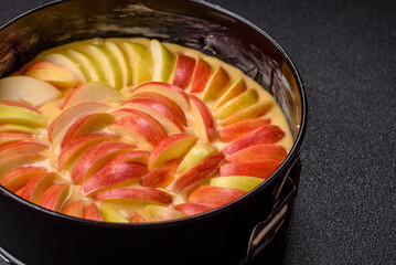 Raw sweet apple pie in a mold prepared for baking