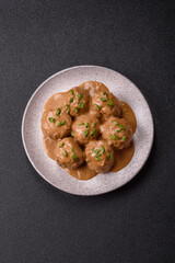 Meatballs with salt and spices in creamy caramel sauce