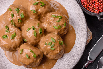 Meatballs with salt and spices in creamy caramel sauce