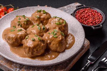 Meatballs with salt and spices in creamy caramel sauce