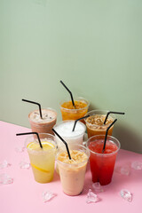 Summer drinks with ice and straws. Lemonade and coctails