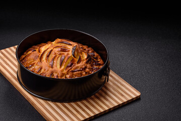 Baked sweet apple pie in a baking dish