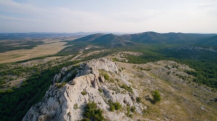 Fototapeta premium Aerial View of Rolling Hills and Expansive Valleys under Clear Blue Skies : Generative AI