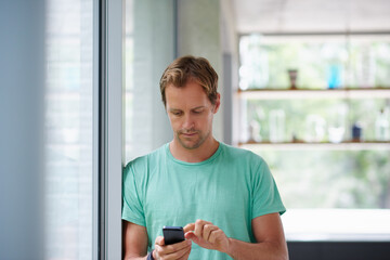 Home, man and scroll with smartphone for social media, connection and online text with contact....