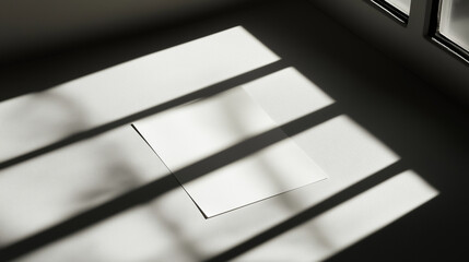 Close-up of a white paper shadow in a room with sun reflection.