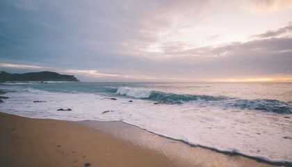Empty Beach Captured at Sunset with Waves Crashing on Shore