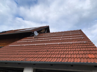 Red Tiled Roof with Aluminum Mounts for Future Solar Panel Installation