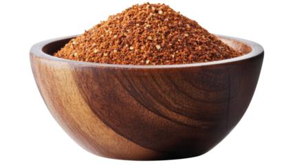 Wooden bowl overflowing with ground aleppo pepper on transparent background